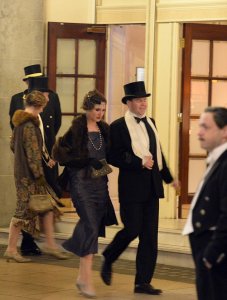 High society: Extras arrive at The Ritz, clad in 1920s outfits, for filming of the last episode